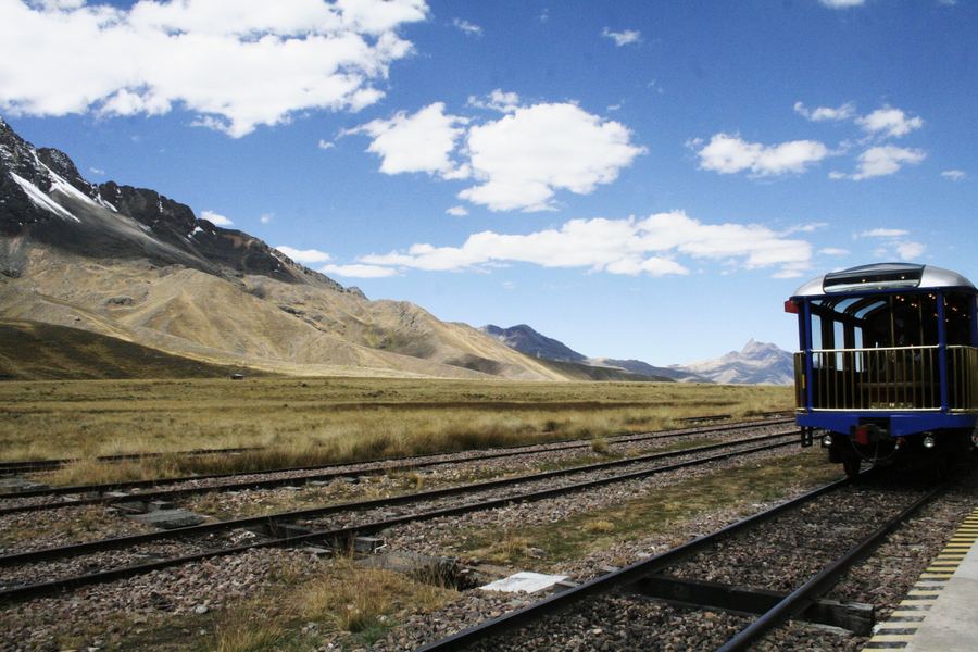 A single passenger carriage on a railway crossing the altiplano